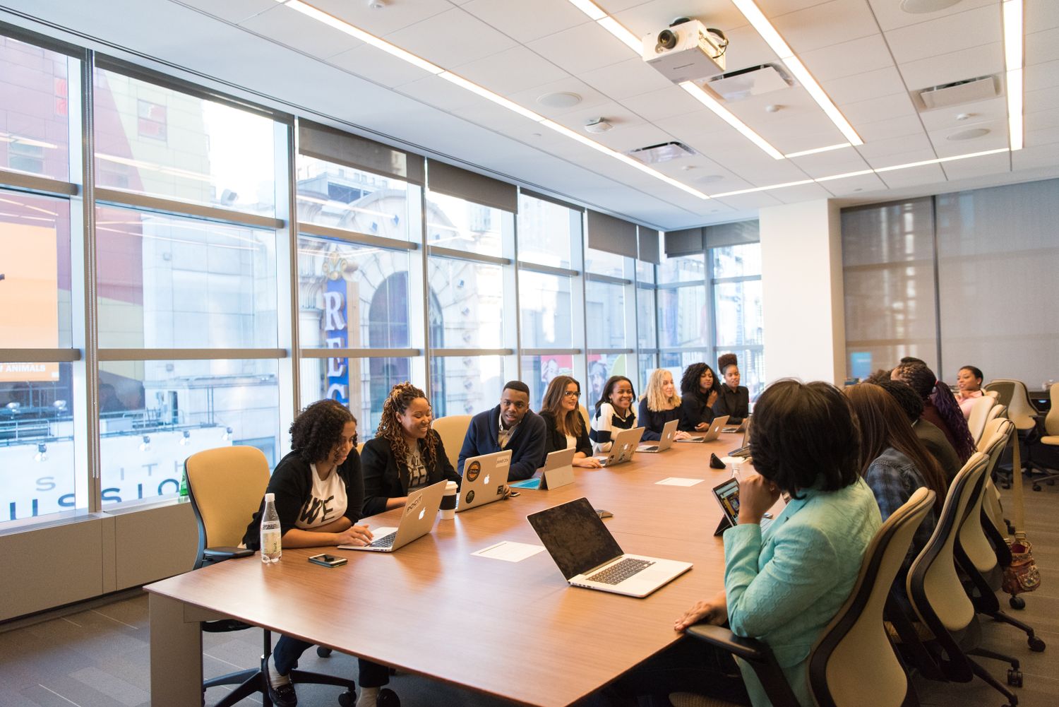 A diverse organisation's team meeting in a boardroom