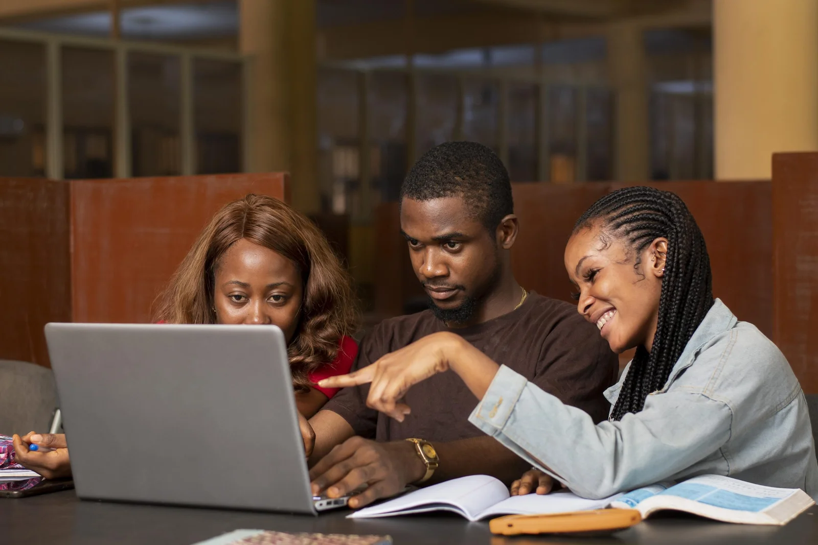 Diverse students studying together with an advisor